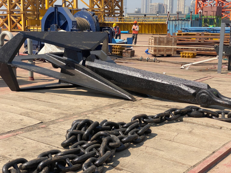 A bower anchor and its chain on the quay