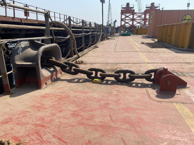 Stud link anchor chain running the length of a deck into the chain stopper