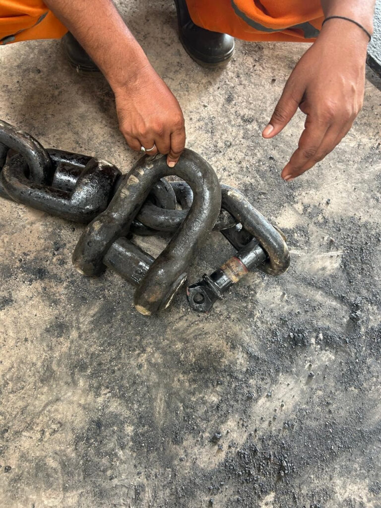Lengths of stud link chain hung in the yard