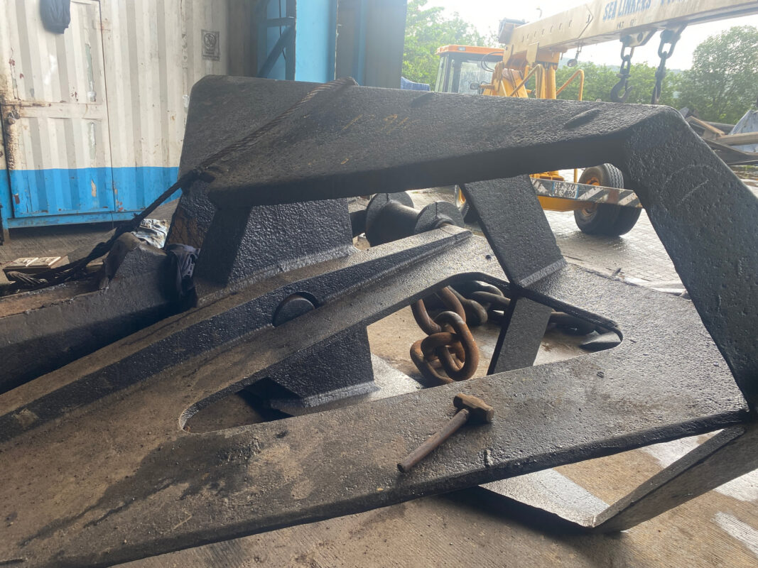 A plate-built delta fluke high-holding-power anchor in the yard