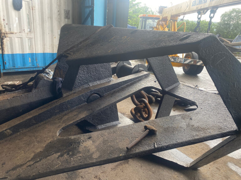 A plate-built delta fluke high-holding-power anchor in the yard
